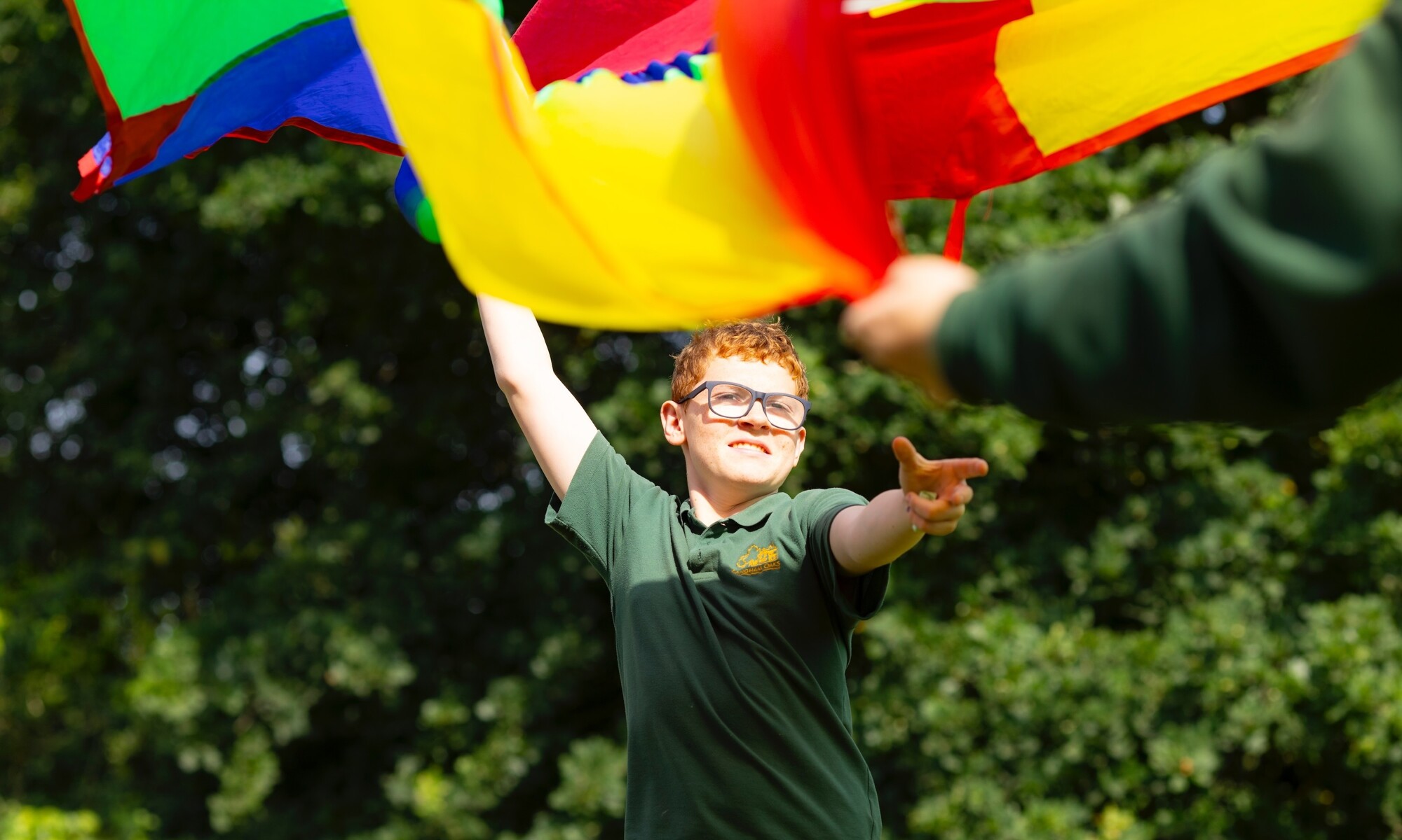 Langham oaks student with flag